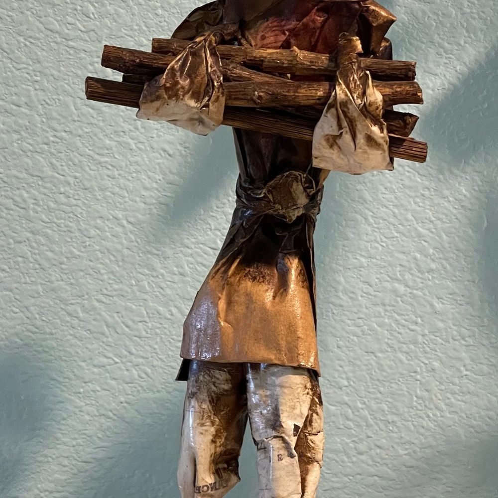 Mexican folk art paper mache villager figurine carrying a stack of wood, Vintage